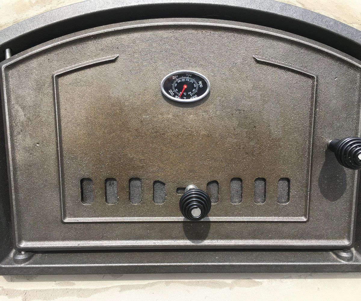cast iron pizza oven door on brick oven outdoor fireplace for Round Grove in Ohio