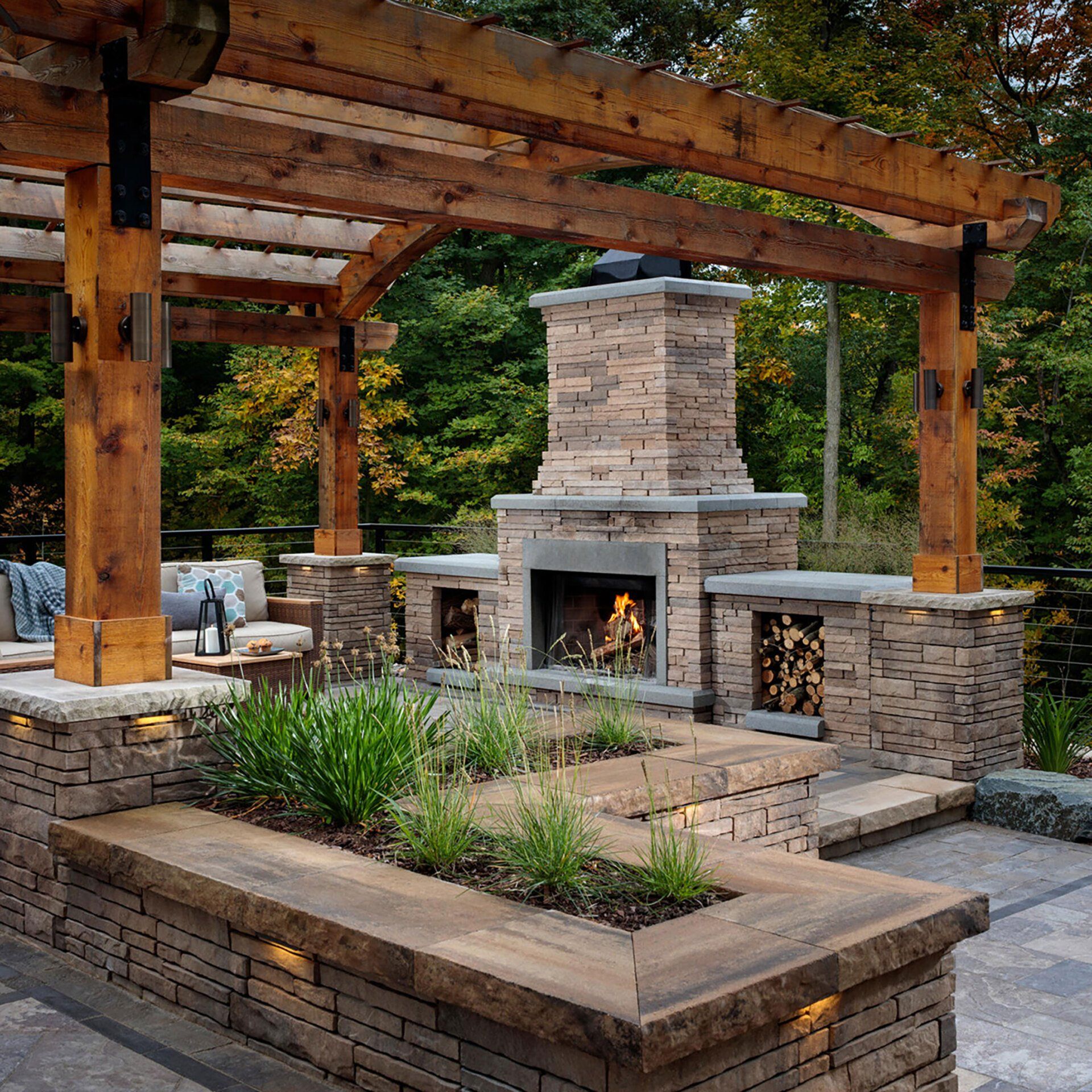 Belgard outdoor stone fireplace pre built under Ohio pergola with outdoor poly furniture