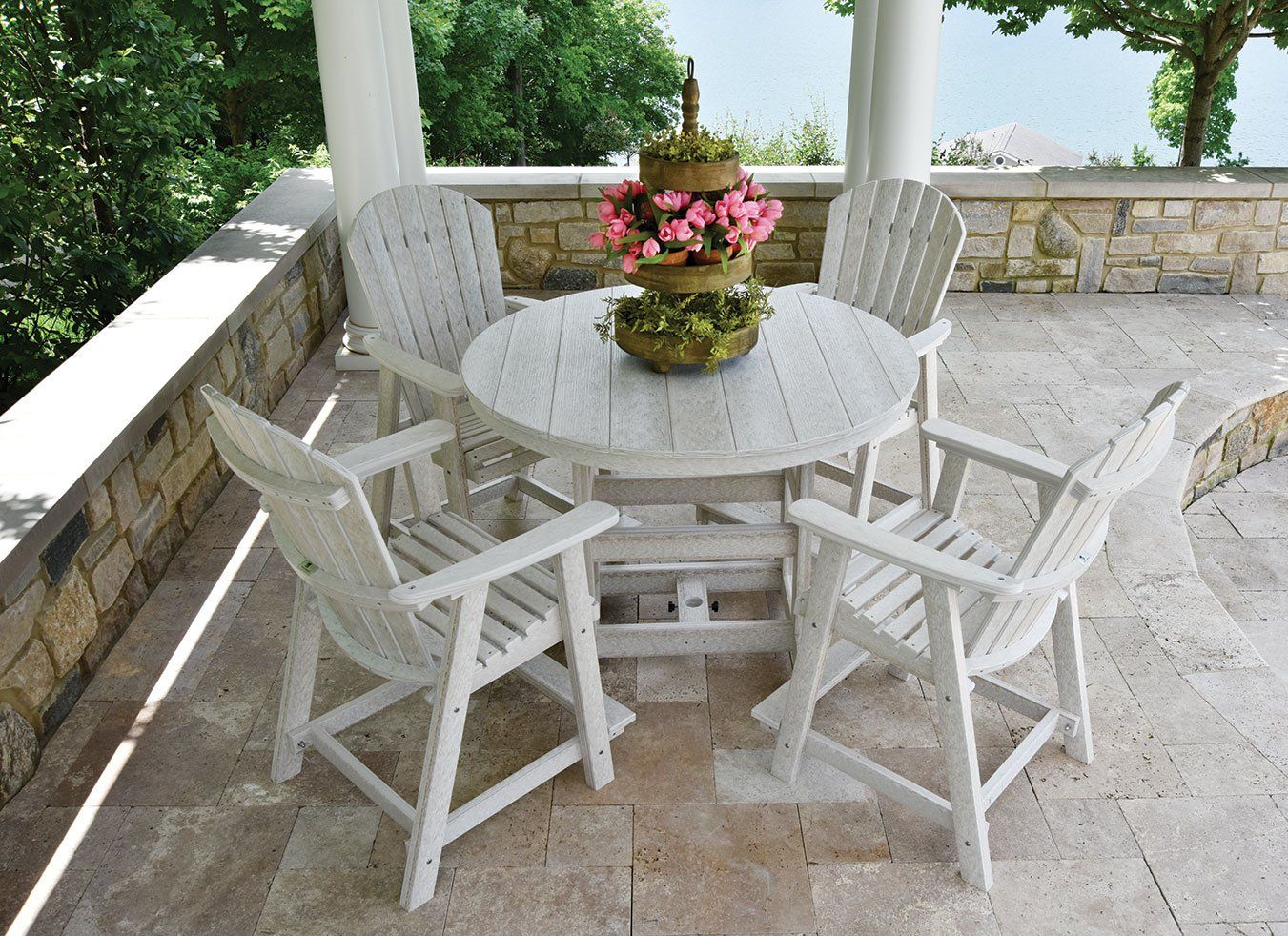Berlin Gardens outdoor dining table and adirondak chairs on Ohio covered porch made from weather resistant  poly lumber material
