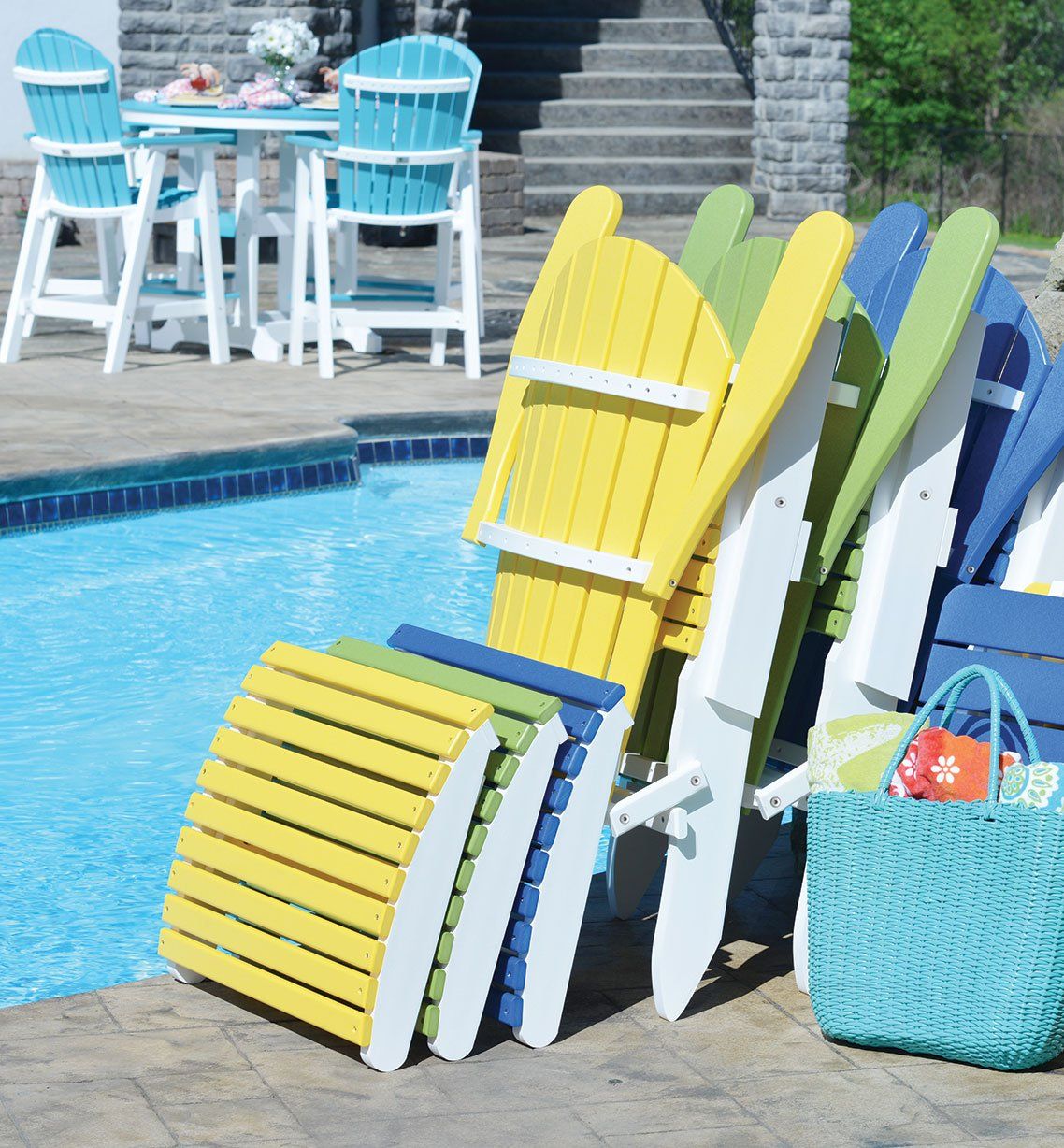 Relaxing by Ohio poolside on folding adirondak chair and folding end table custom amish made by Berlin Gardens comfo back collection