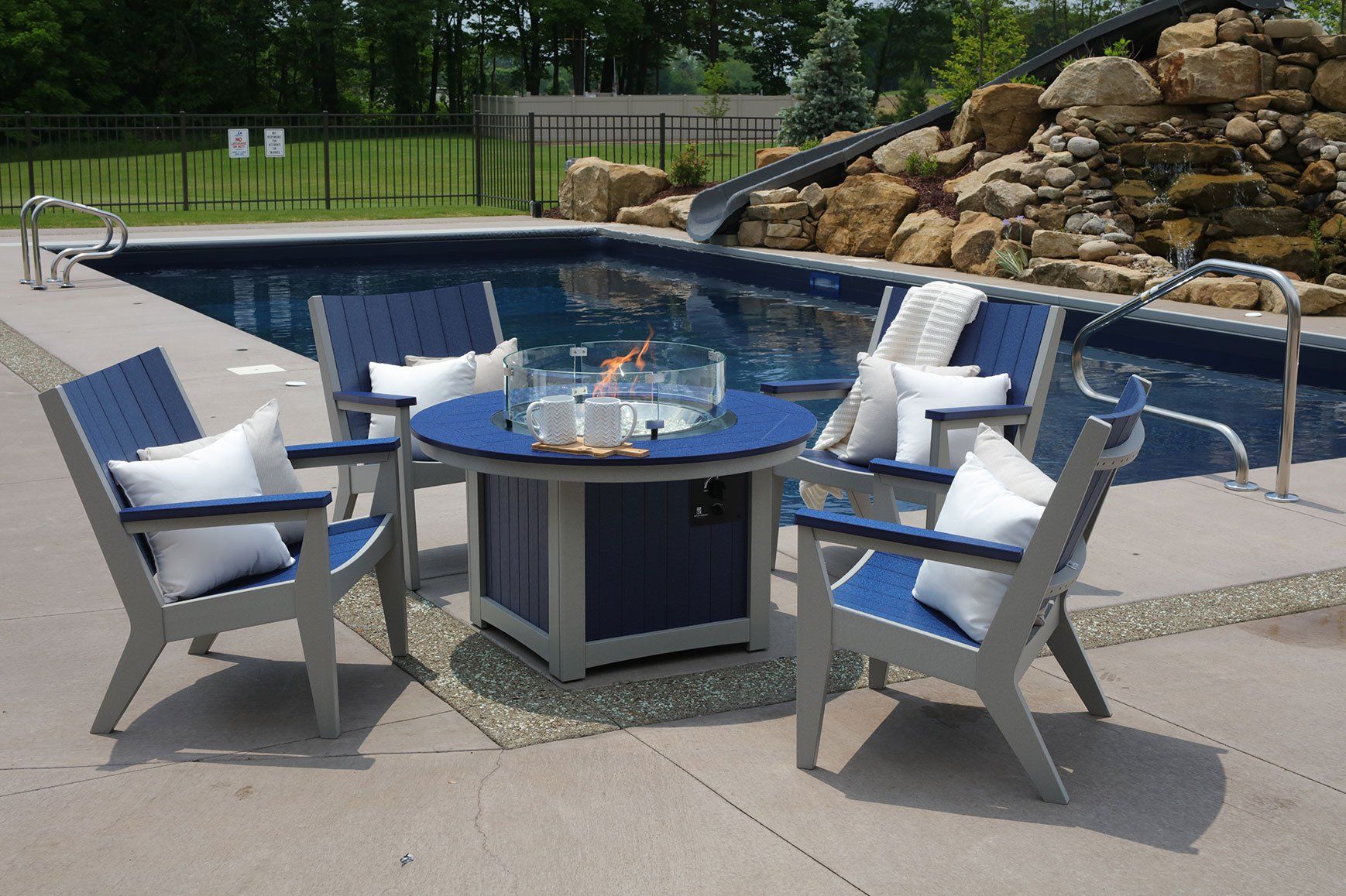Berlin Gardens Mayhew chat chairs by Ohio poolside near propane fire pit made from poly lumber