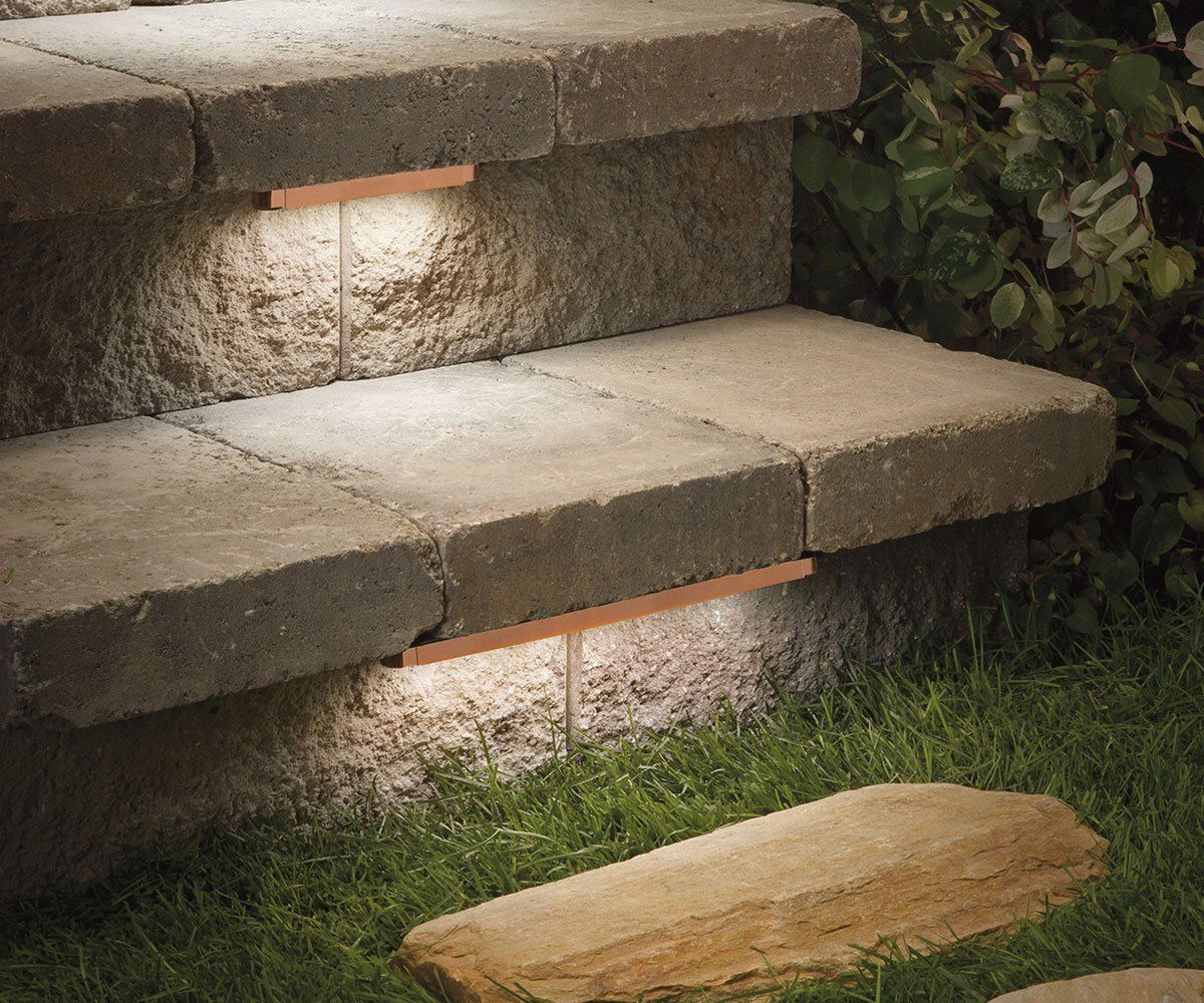 outdoor under cap landscape lighting on paver steps in ohio backyard
