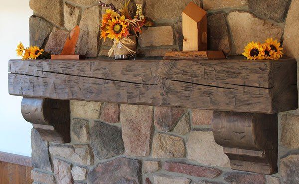 Hand hewn custom amish solid wood fireplace mantel with corbels