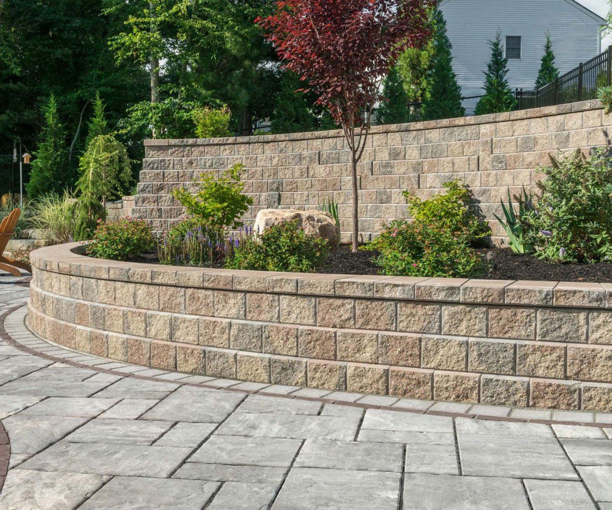 Madison Ohio home with exterior retaining hardscape garden wall