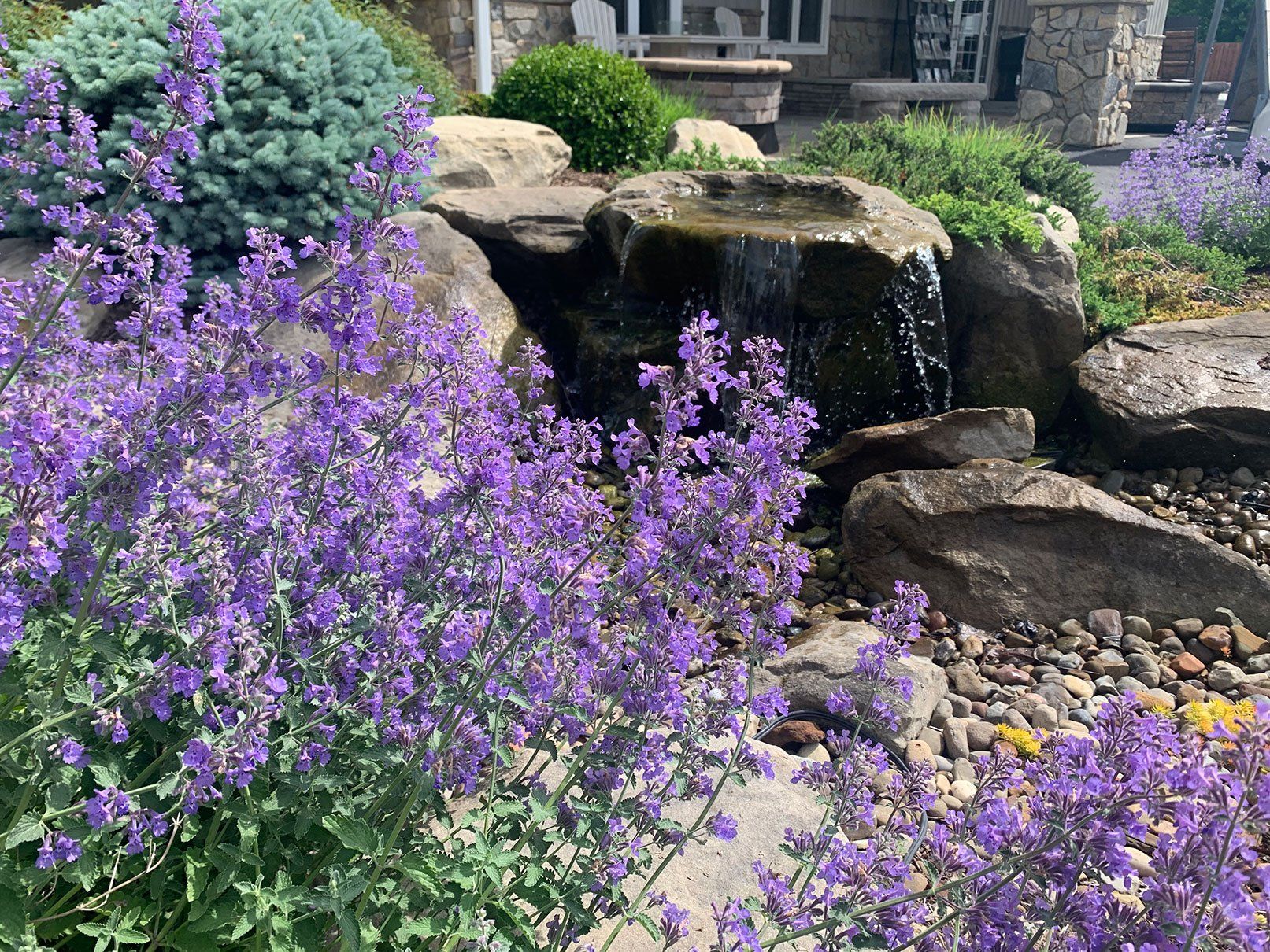 Waterfall made from a natural landscape stone boulder in Ohio backyard