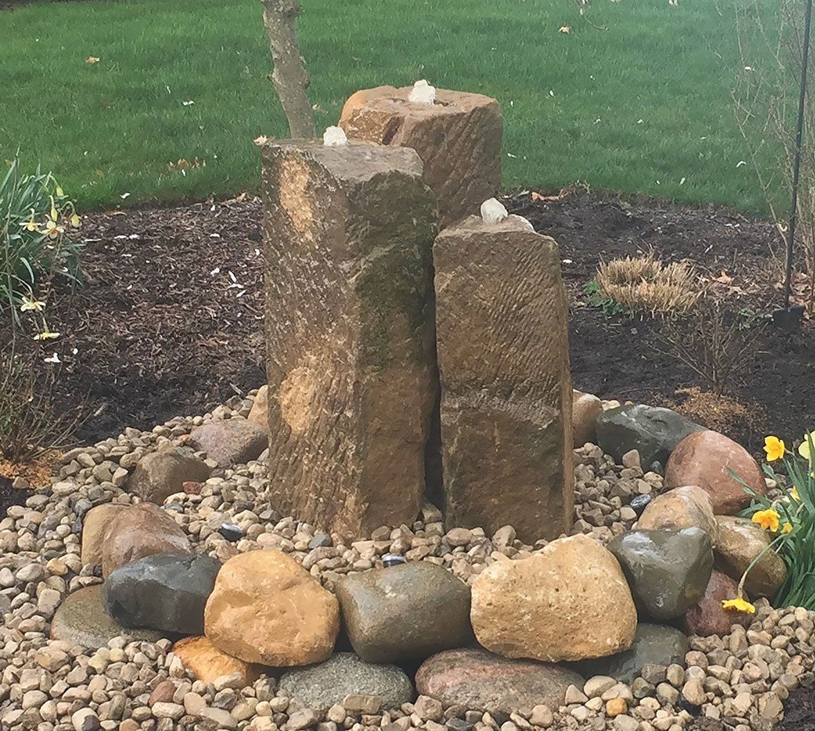 Natural Barn Stone Bubbler Water Fountain in Huron Ohio backyard