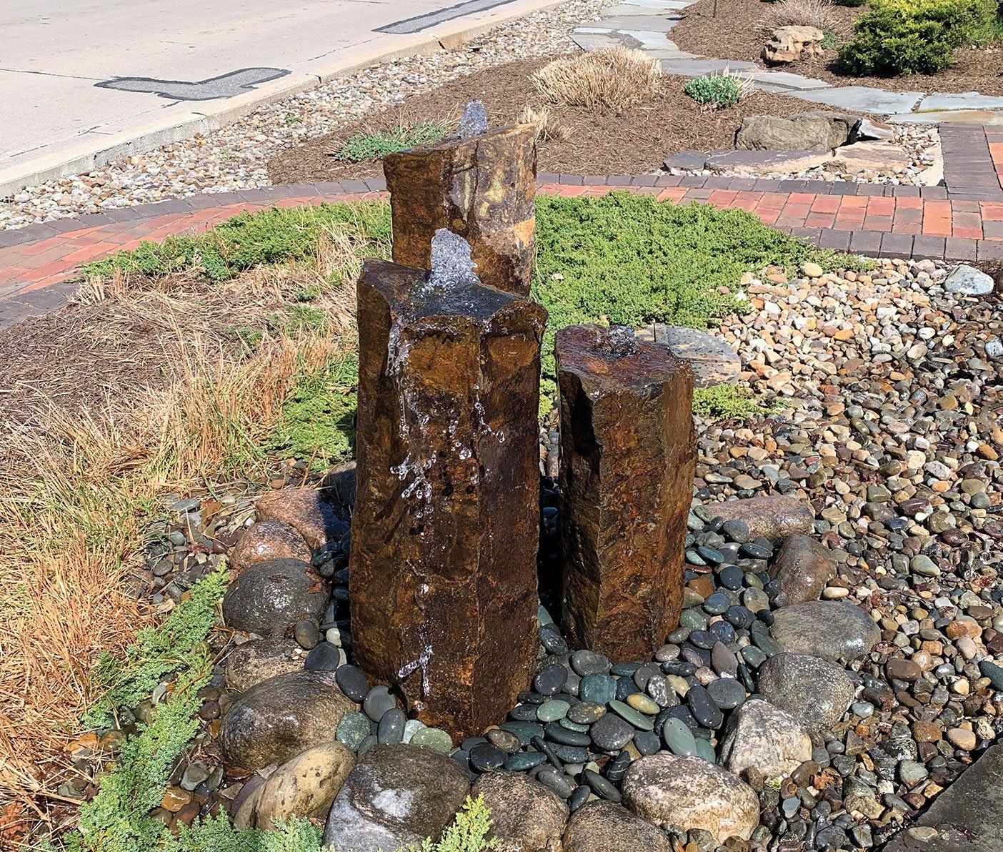 Basalt natural stone columns water fountain in Ohio backyard