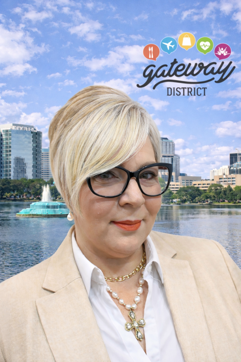 A person with blonde hair and glasses wearing a blazer, set against a background of a city skyline and water fountain. New executive Director Judimar Pesante