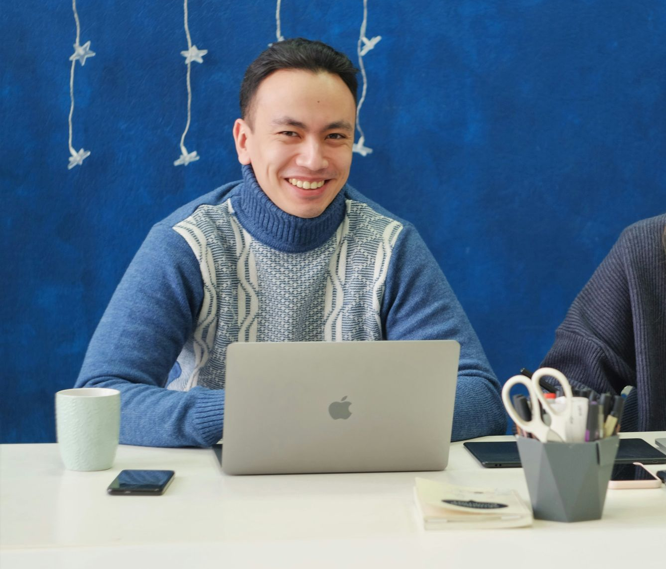 Glowing neon figures connected by lines, representing a digital social network.