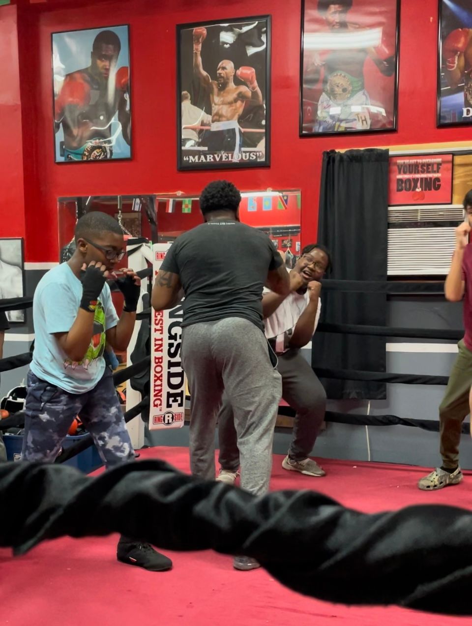 A boxing ring with a sign that says ' inside ' on it