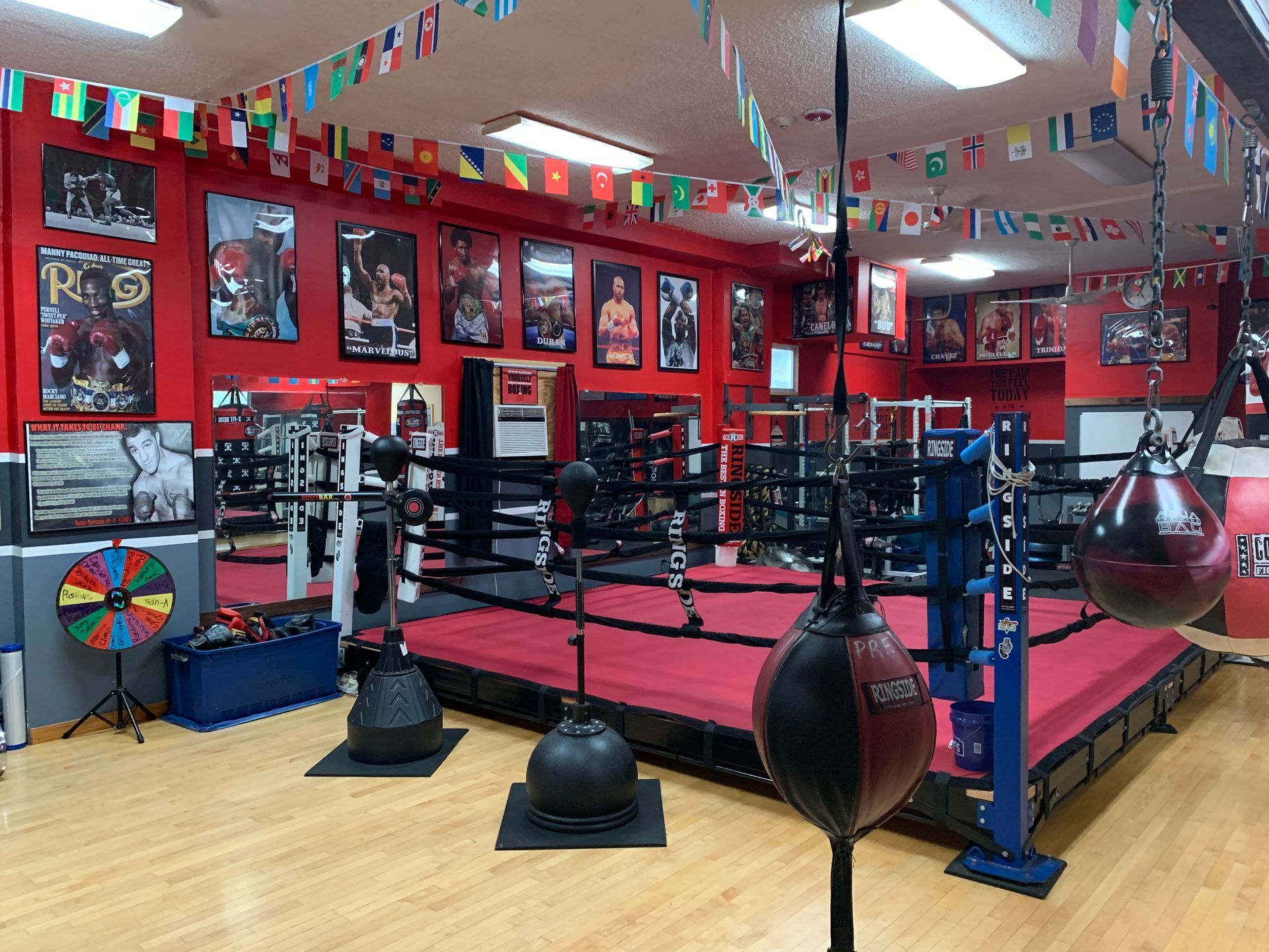 A gym with a lot of exercise equipment and dumbbells