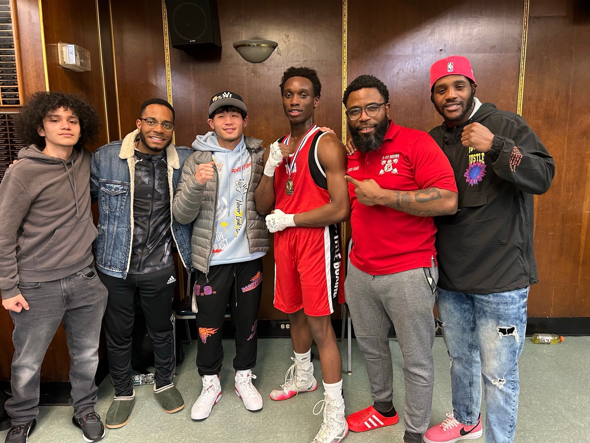 A group of young men are posing for a picture together.