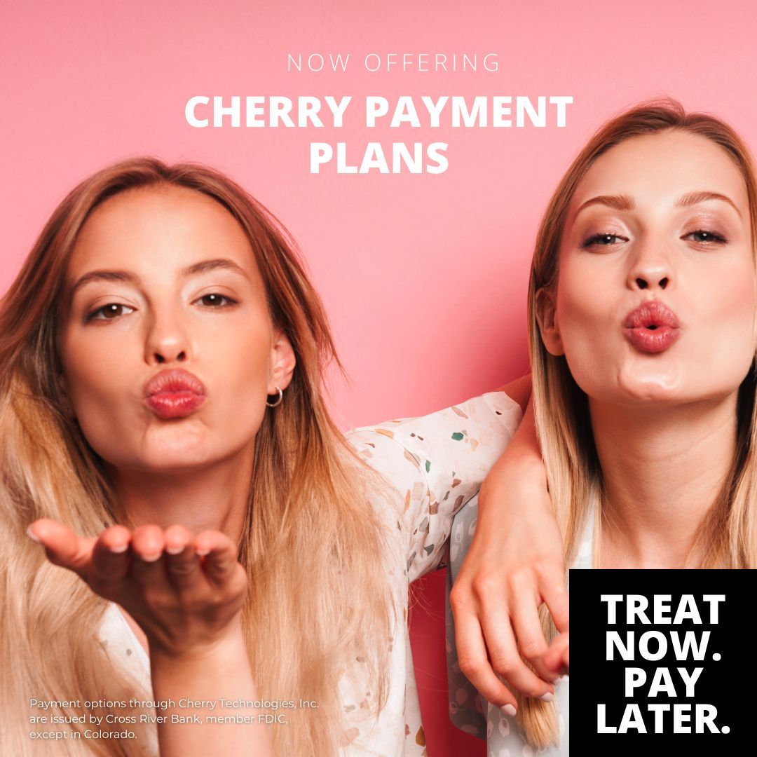 two women blowing kisses in front of a sign that says treat now pay later