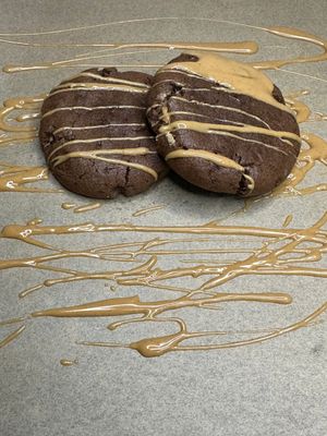 Chocolate based cookie with peanut butter filling in the center