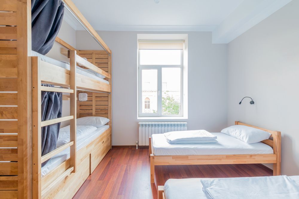 A Dorm Room With Bunk Beds and Two Beds — Key2 Conveyancing In Forster, NSW