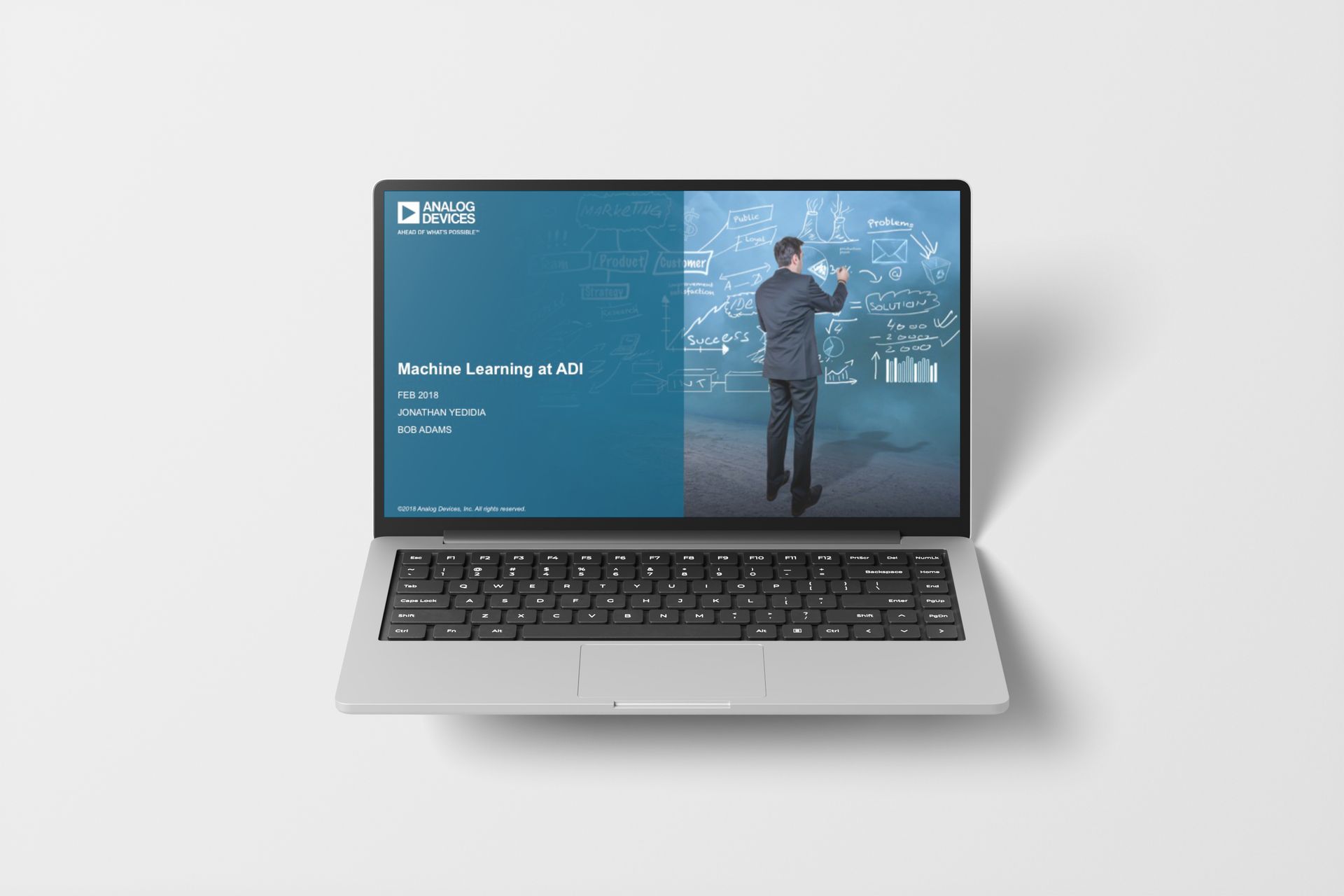 Laptop displaying a presentation on artificial intelligence. A man in a suit gestures at a glowing digital interface.