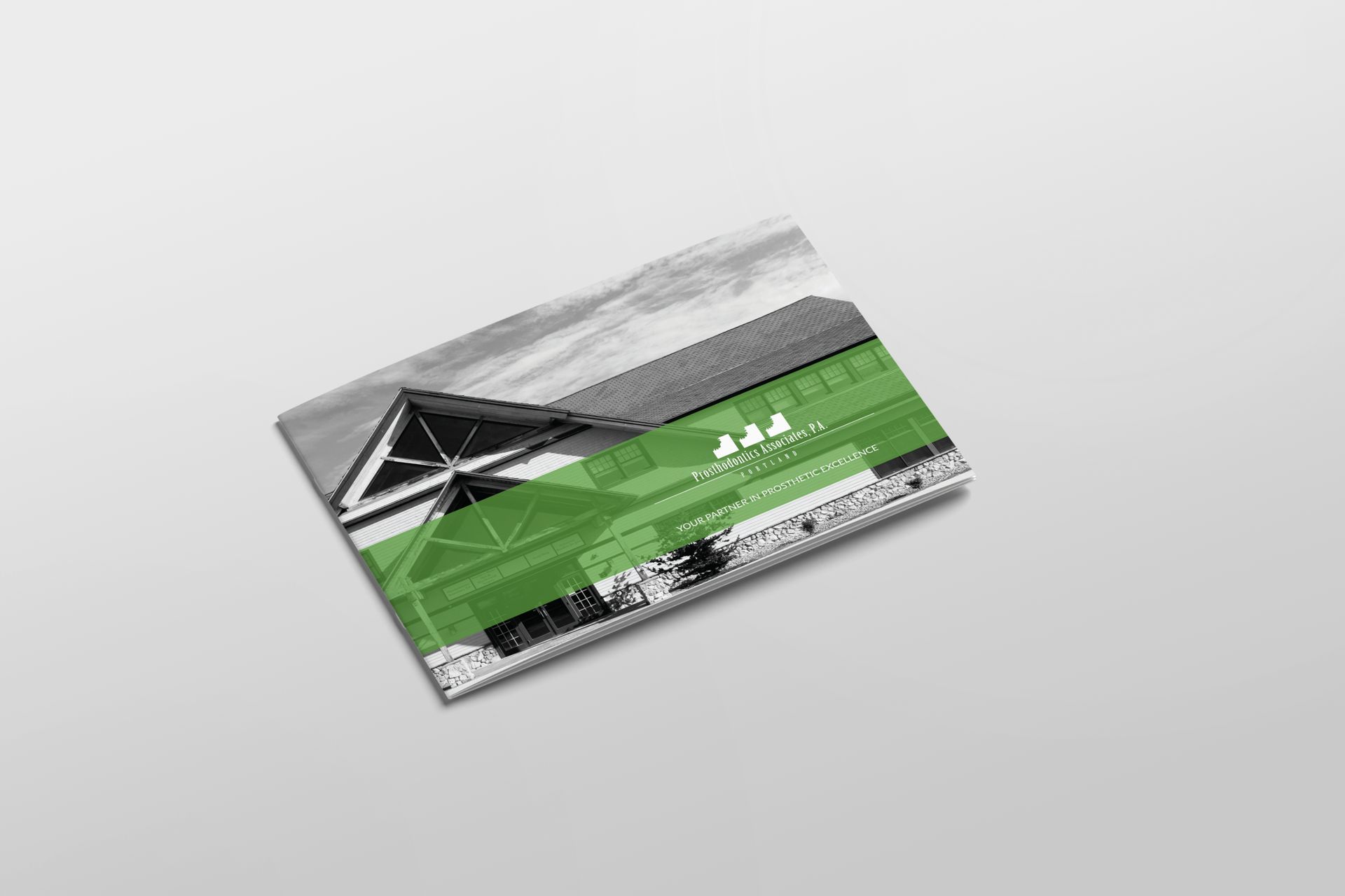 Brochure, partial view of building, green overlay highlighting architectural features.