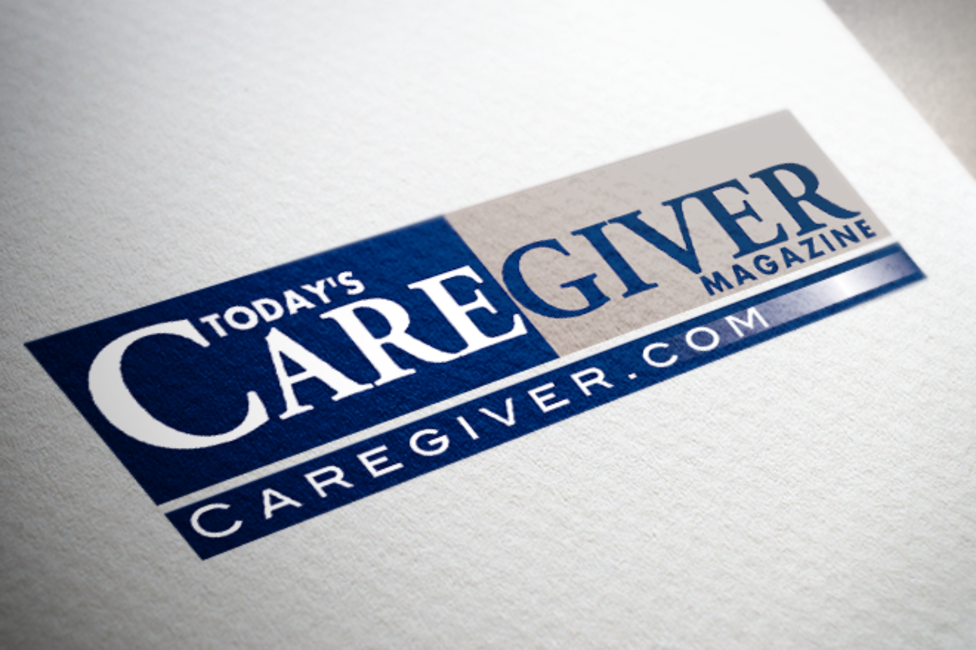 Logo for Today's Caregiver Magazine in blue and white on a textured white surface.