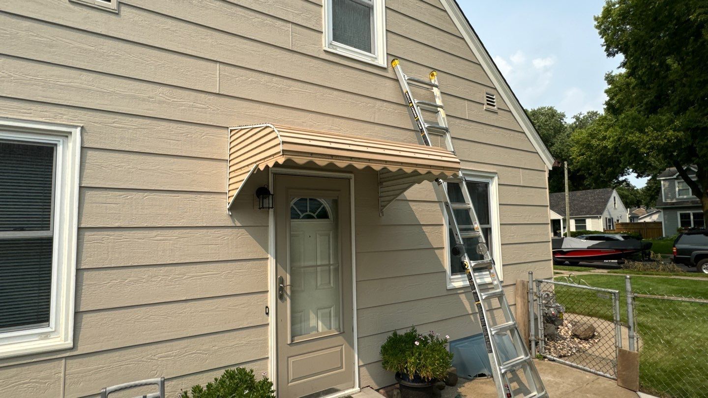 A house with a ladder on the side of it