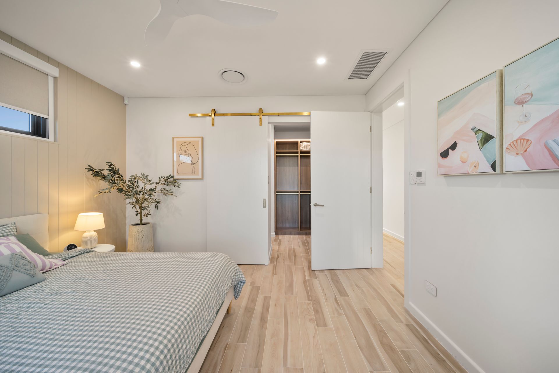 Bright Modern Bedroom With a Bed, White Walls — Simon Bell Constructions in Alice River, QLD