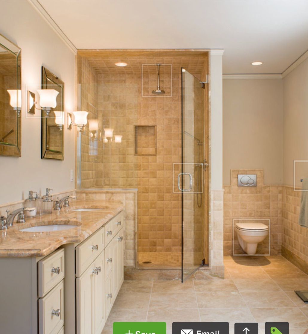 a bathroom with two sinks a toilet and a shower