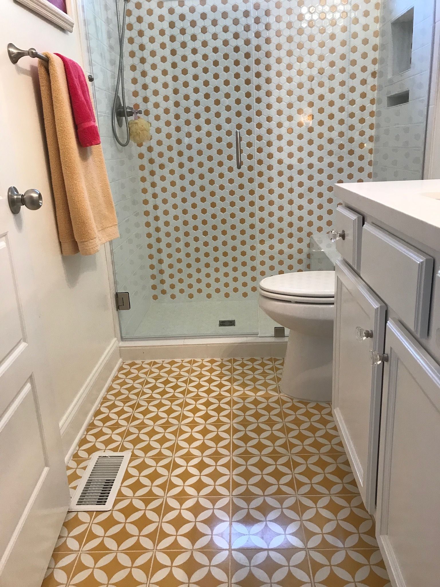 a bathroom with a toilet , sink , and shower