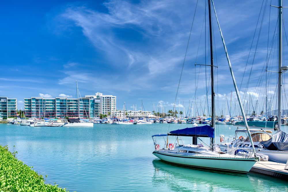 A Sailboat Is Docked In A Marina With A Lot Of Boats In The Water — Life Legal in West End, QLD