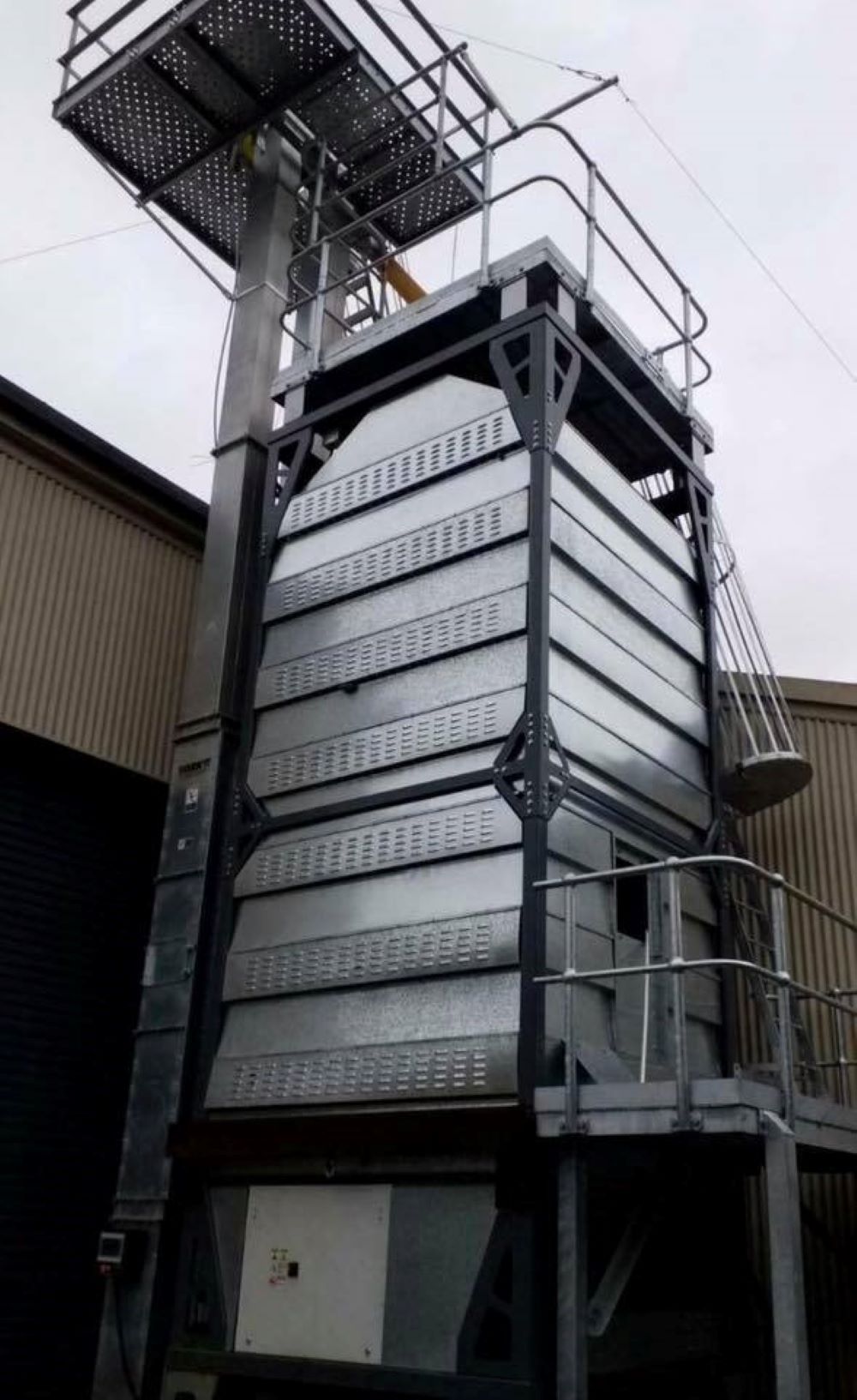 A Large Metal Structure With Stairs Leading Up to It — Wallamore Grading & Packaging In Armidale, NSW