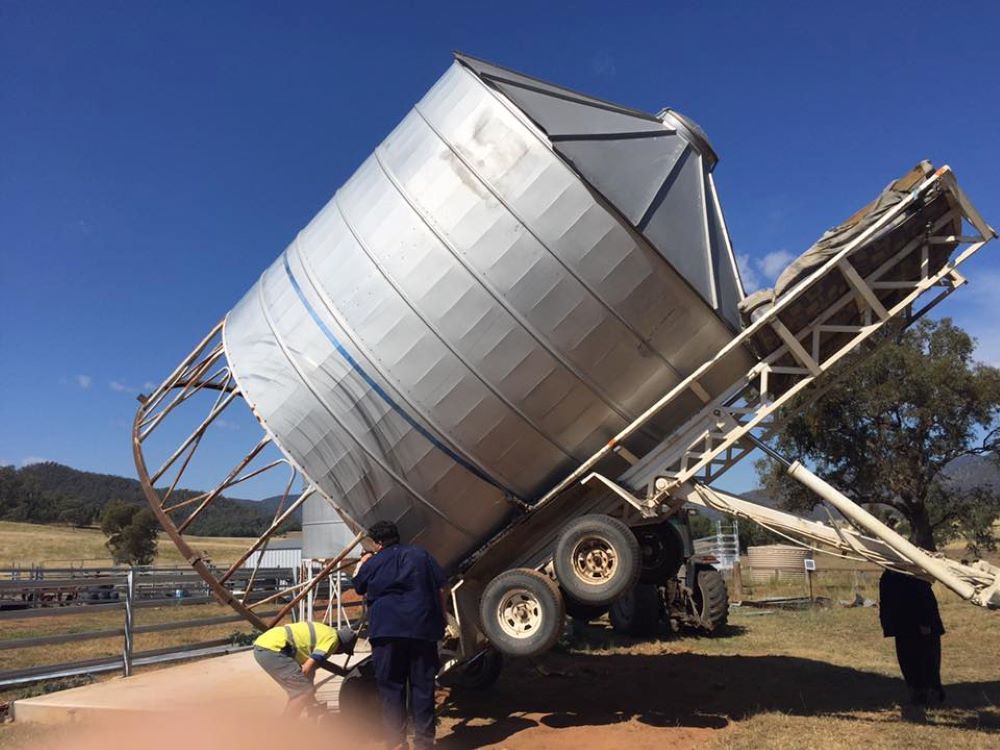 A Large Silo is getting transported by a trailer — Wallamore Grading & Packaging In Barraba, NSW