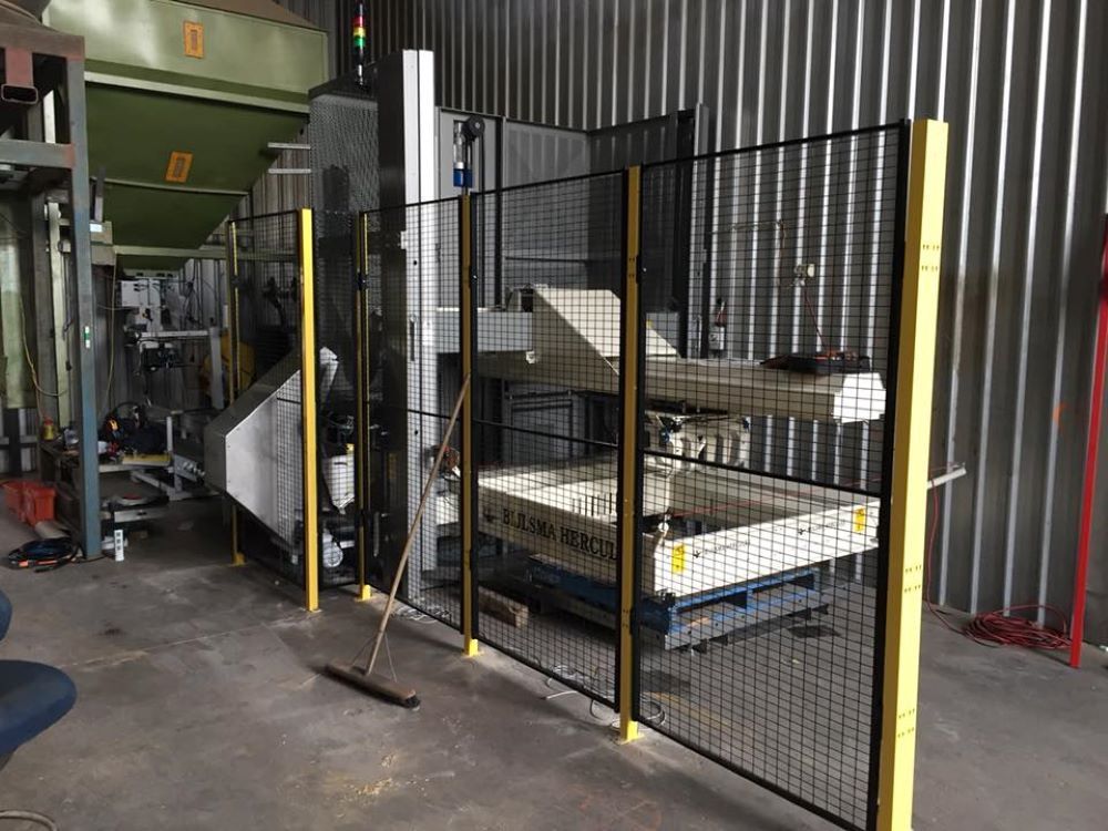 A Machine is Behind a Fence in a Factory — Wallamore Grading & Packaging In Gunnedah, NSW