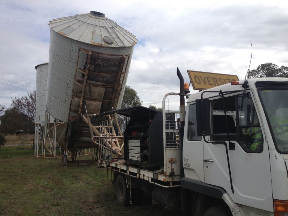 A White Truck Transporting A Silo — Wallamore Grading & Packaging In Quirindi, NSW