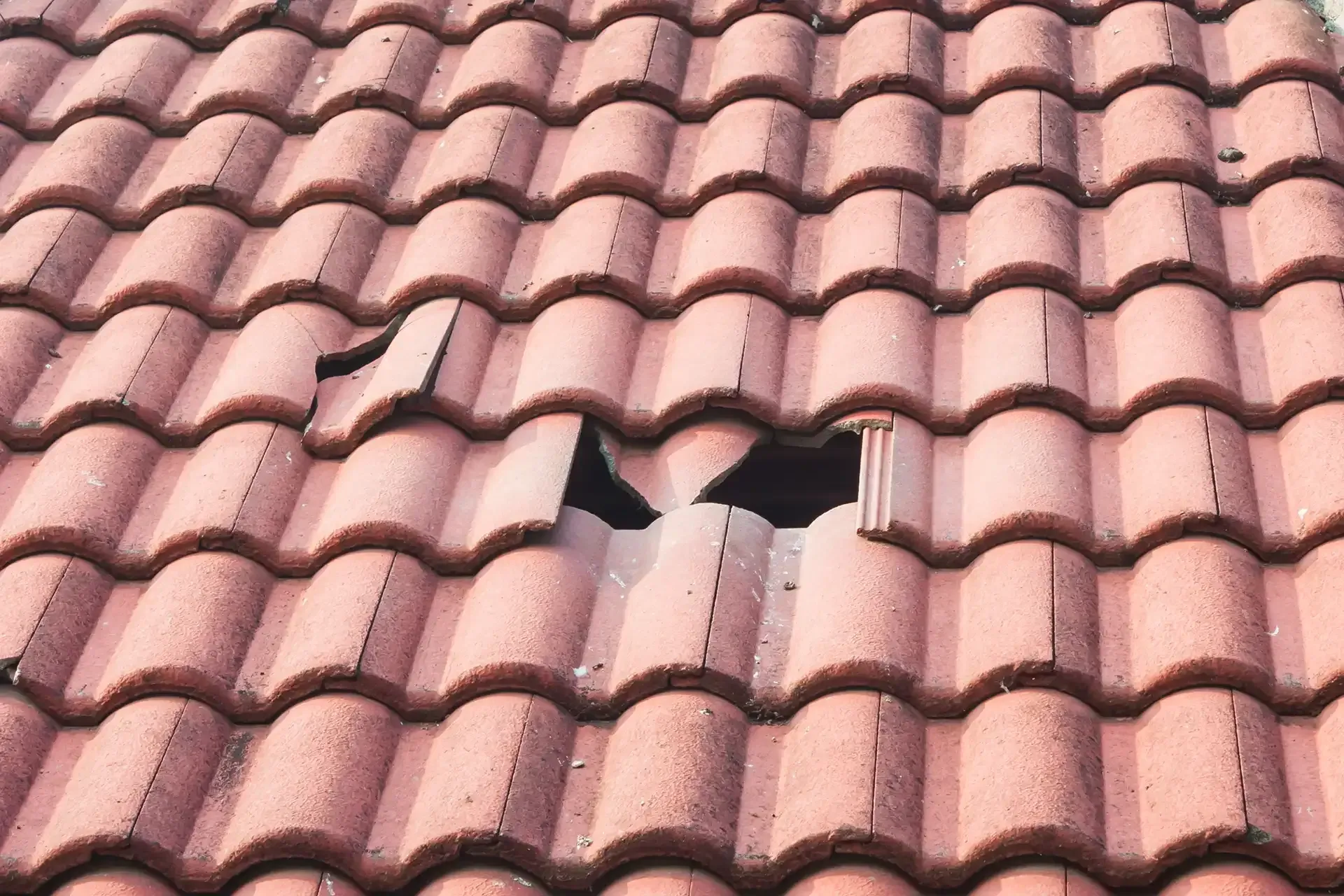 A close up of a roof with a hole in it.