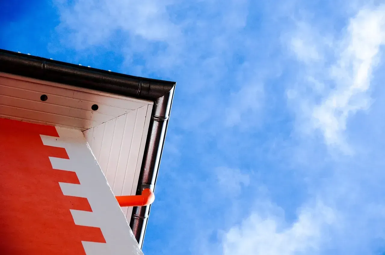 A red and white building with a blue sky in the background.