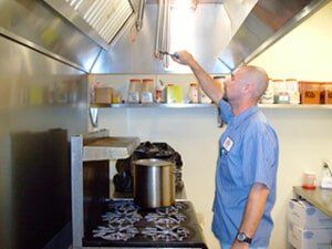 Worker checking vents — Fire Safety equipment in Corpus Christi, TX