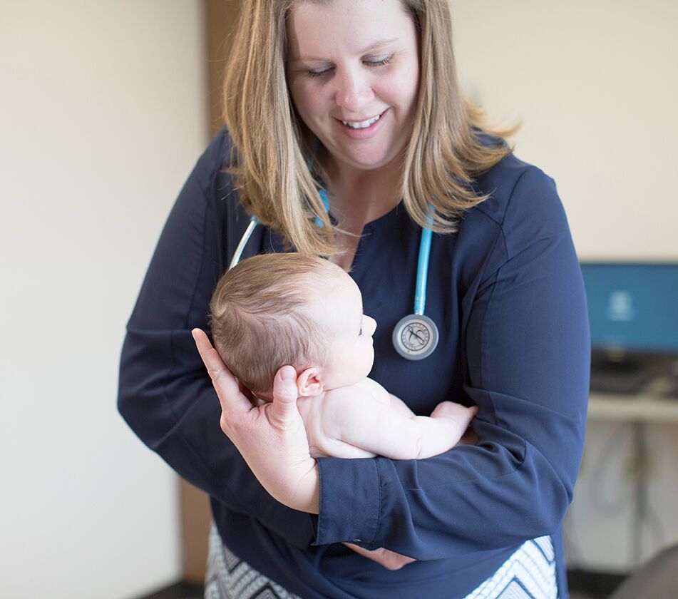 Doctor holding a baby