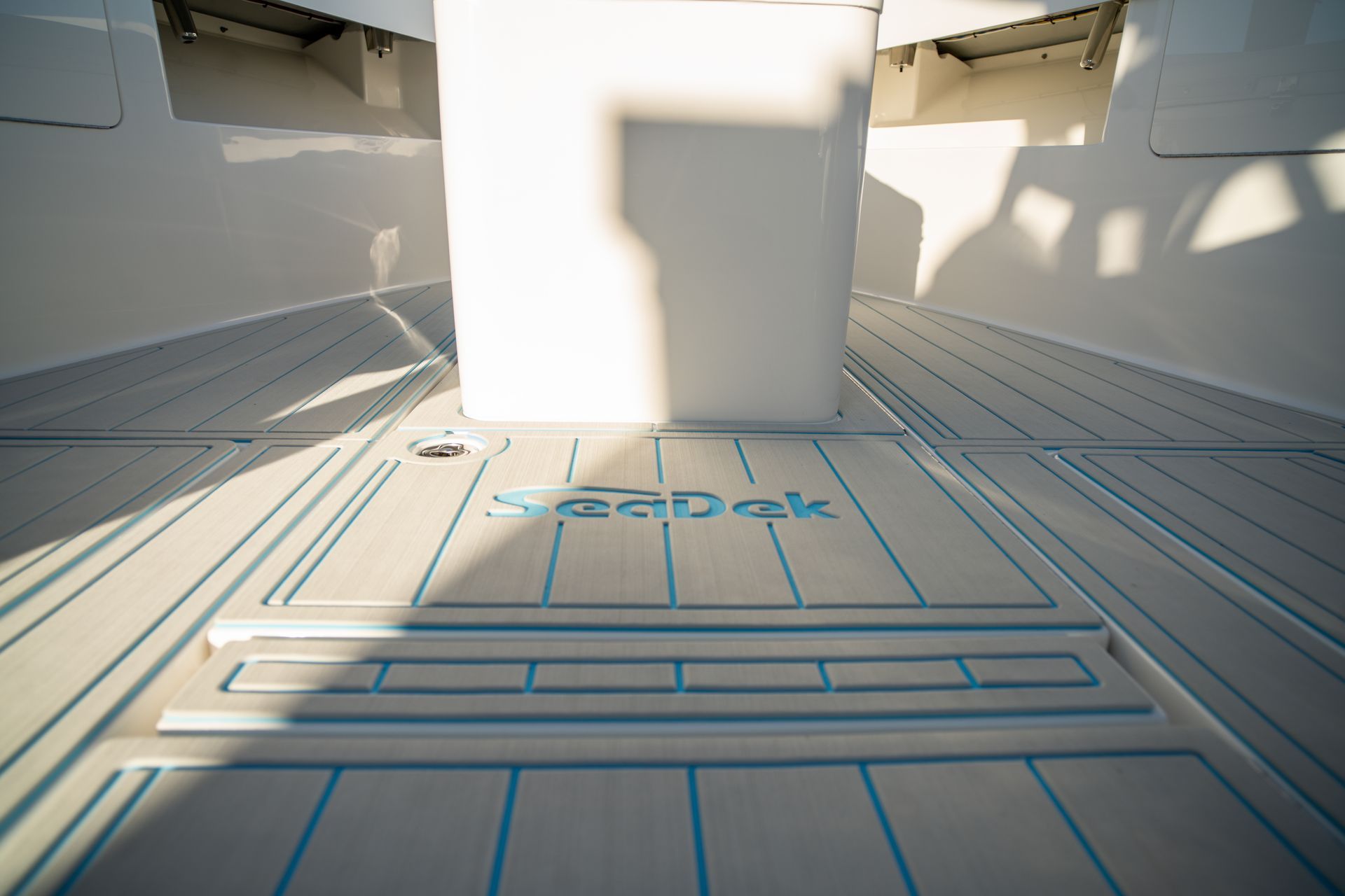 Boat interior with Seadek flooring, light grey with blue accents, near white compartment.