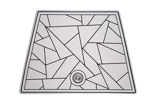 White, geometric-patterned sink with black outlines. A drain is in the center.