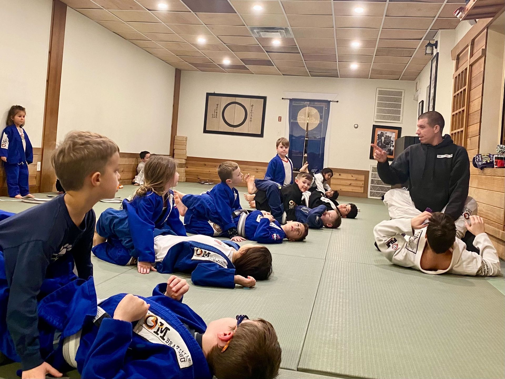 Kids practicing Brazilian Jiu-Jitsu drills at OM Brazilian Jiu JItsu & Judo in Northport, NY, building leadership.