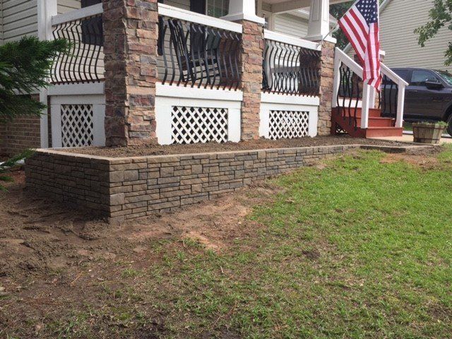 A house with a porch and an american flag on it