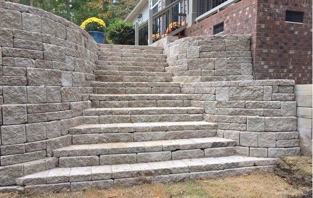 A set of stone stairs leading up to a house.