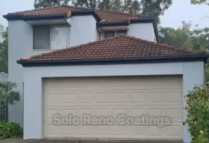 A white house with a brown roof and a beige garage door — Solo Reno Coatings In Gold Coast, QLD