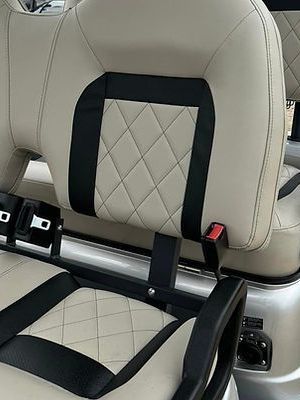 A close up of the back seat of a golf cart.