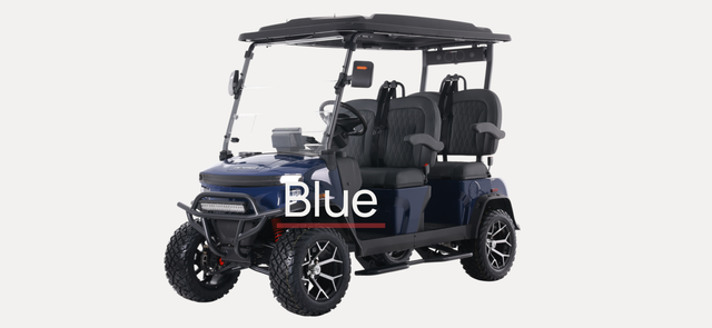 A white golf cart is parked on the side of the road in front of a building.