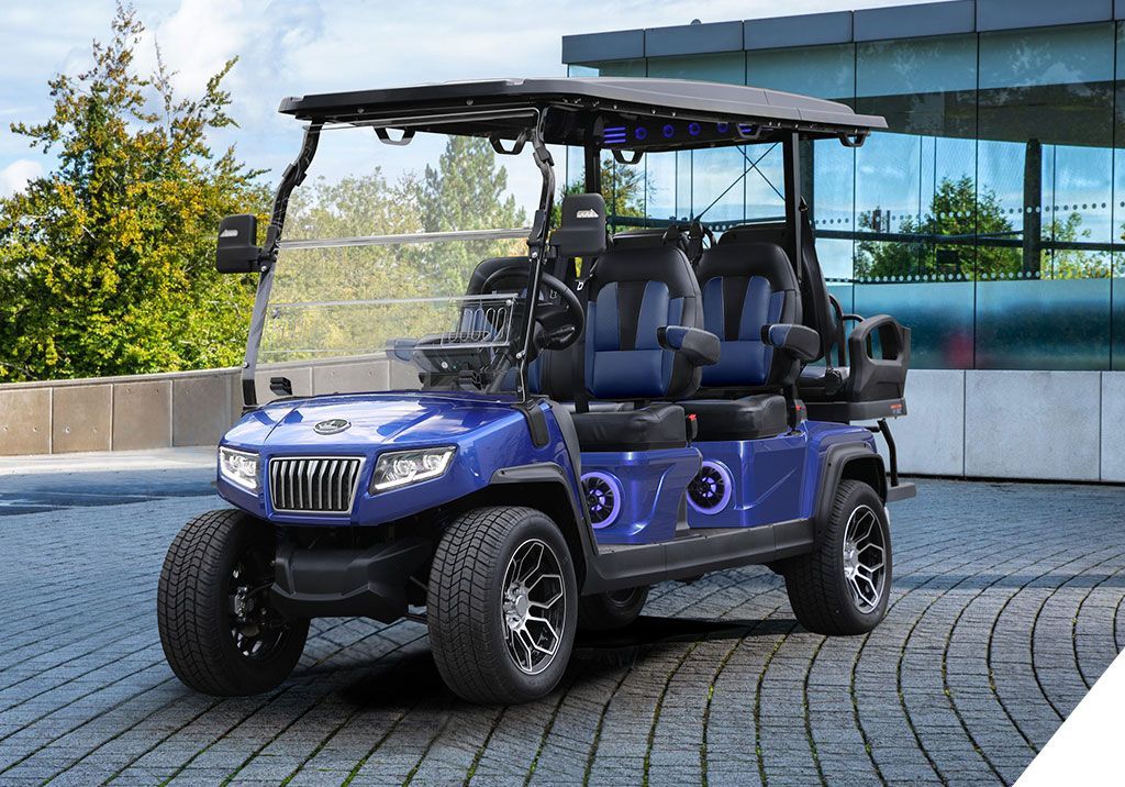 A blue golf cart is parked in a parking lot.