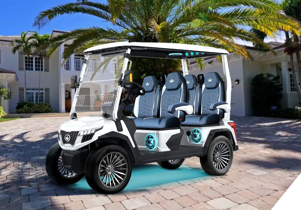 A blue golf cart is parked in a parking lot.