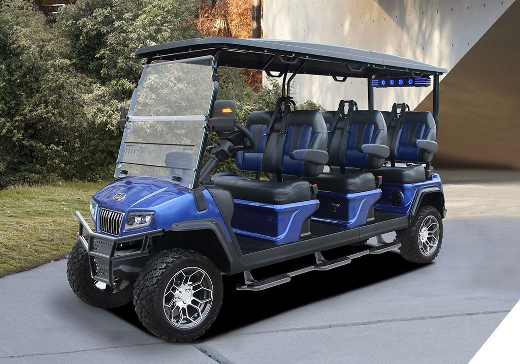 A blue golf cart is parked on the side of the road.