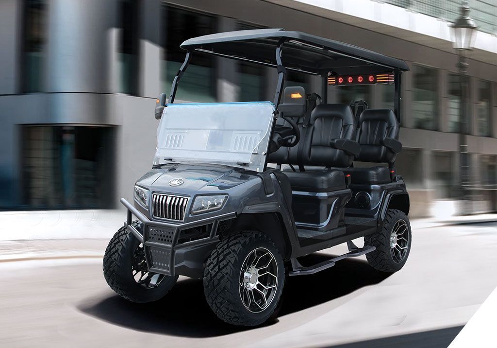 A black golf cart is driving down a city street.