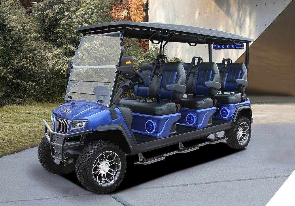 A blue golf cart is parked on the side of the road.