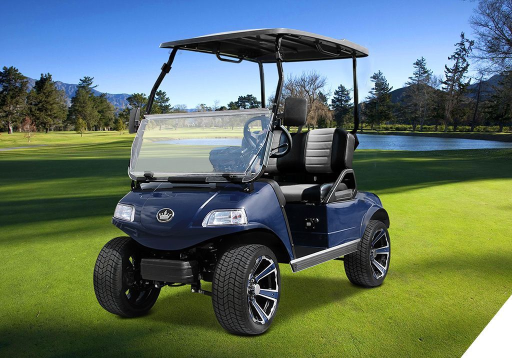 A blue golf cart is parked on a lush green golf course.