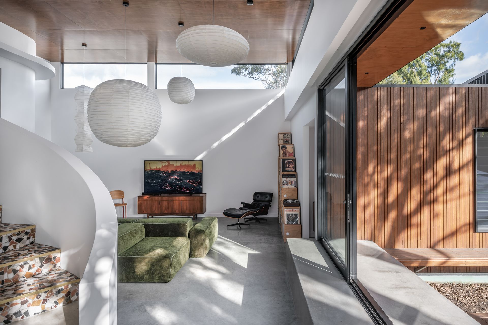 A Living Room With a Television , Chairs  — DeBu Studios In Southern Sydney, NSW